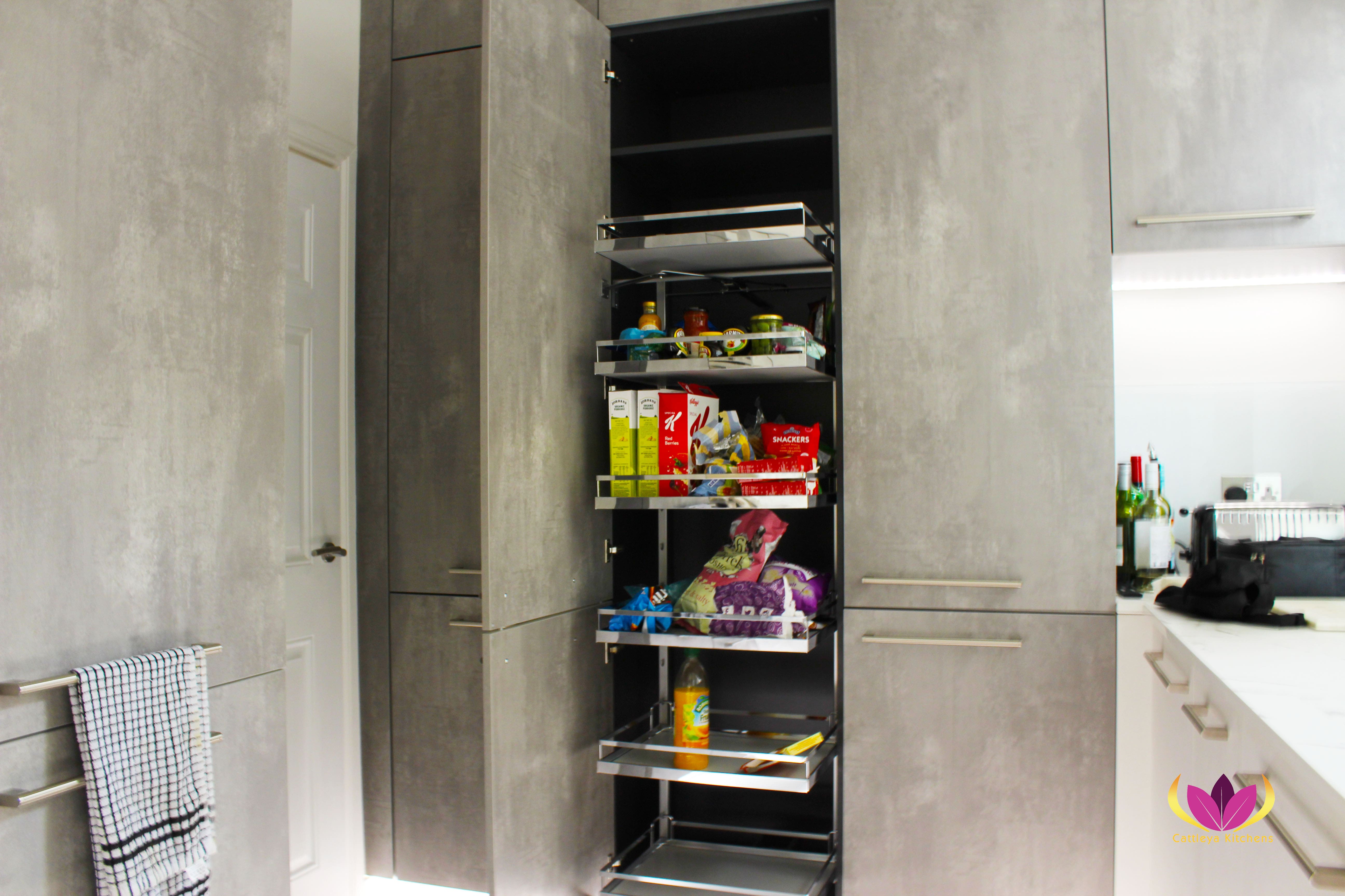 Sliding metal fittings inside tall cabinet unit - Belsize Park Finished Kitchen Project
