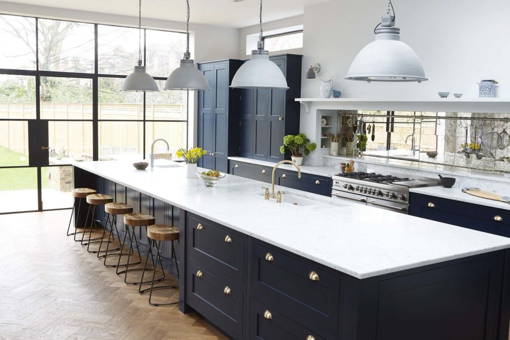 navy blue kitchen with tan wall